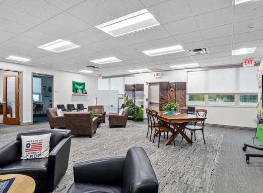 Designer Roller Shades open halfway in Recreational Room