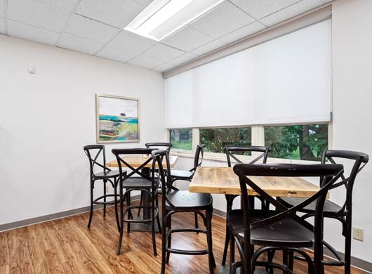 Designer Roller Shades Halfway in Break Room