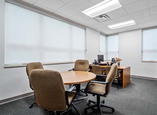 Designer Roller Shades Closed in Office