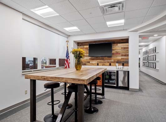 Designer Roller Shades Halfway in Conference Room