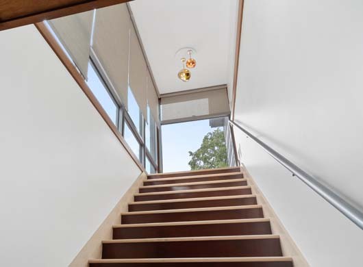 Designer Solar Screen Shades Halfway in Stairway