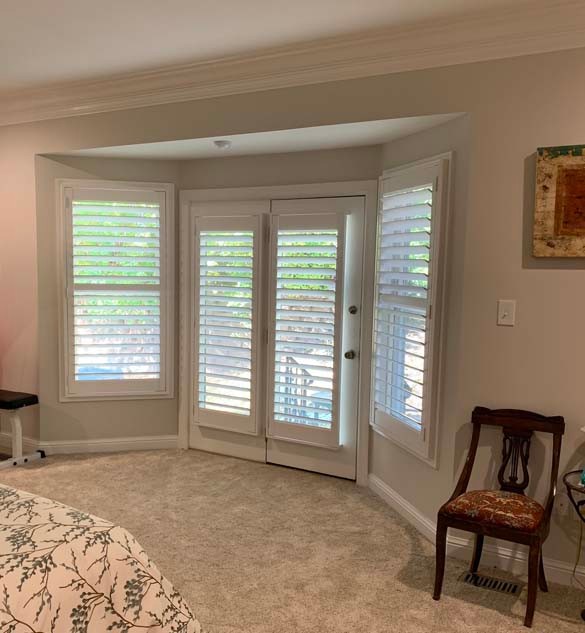 Palm Beach™ Polysatin™ Shutters in Master Bedroom